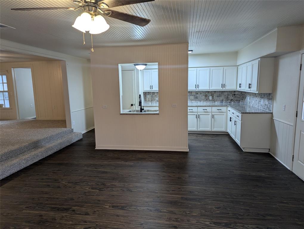 502 East Baker Street Hamilton, TX 76531 - Photo 37 of 37 a view of a kitchen with a sink cabinets and wooden floor