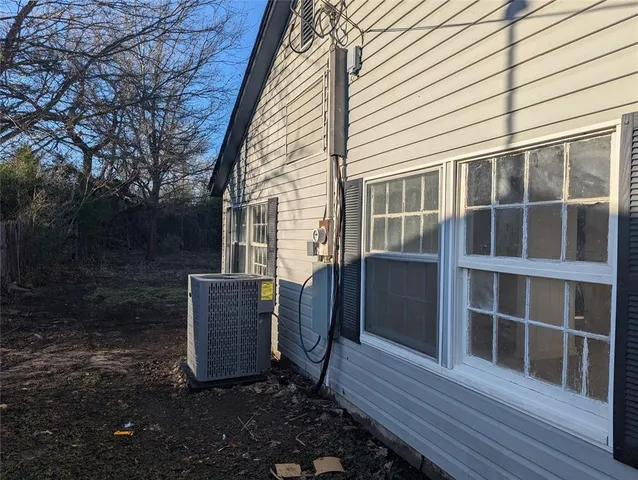 a view of a two chairs in the balcony
