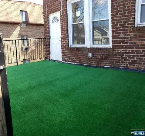 a view of front door of house and yard