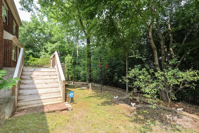 a backyard of a house with lots of green space