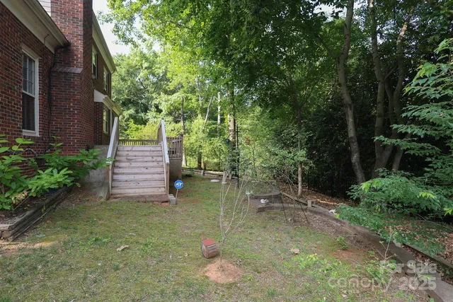 an aerial view of a house with outdoor space and street view