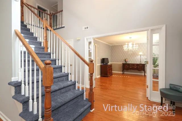 a view of a workspace with furniture and wooden floor