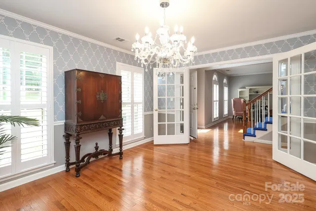 a view of a livingroom with furniture window and wooden floor