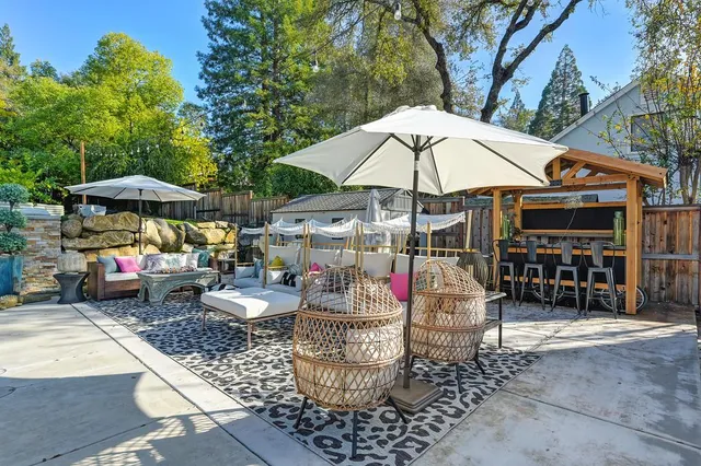 a front view of a house with outdoor seating