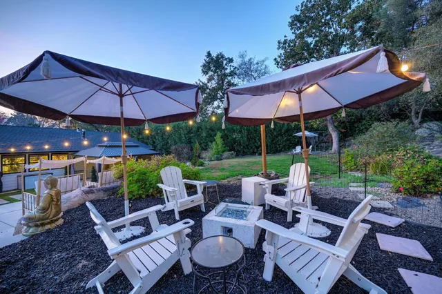 a view of a swimming pool with an outdoor seating