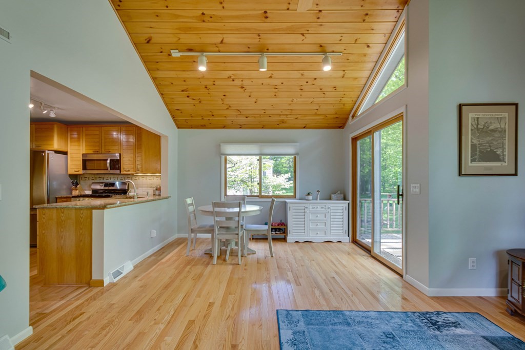 65 Angelica Drive Framingham, MA 01701 - Photo 11 of 34 a kitchen with a sink appliances dining table and wooden floor