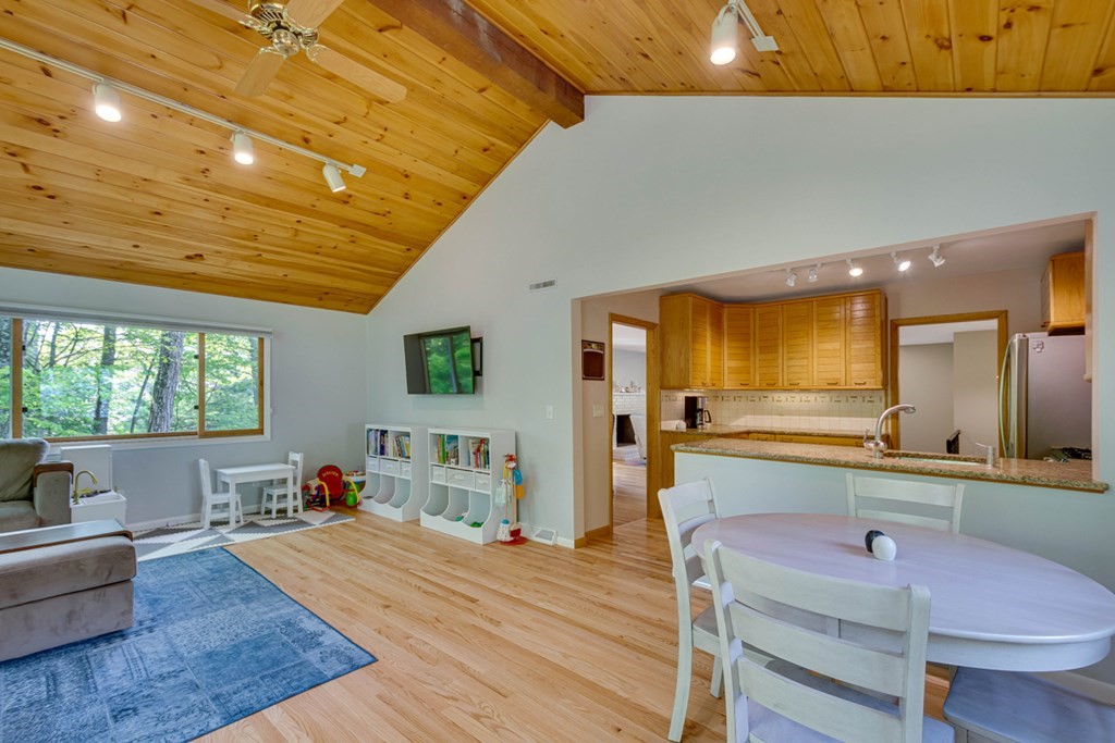 65 Angelica Drive Framingham, MA 01701 - Photo 12 of 34 a living room with furniture a large window with kitchen view