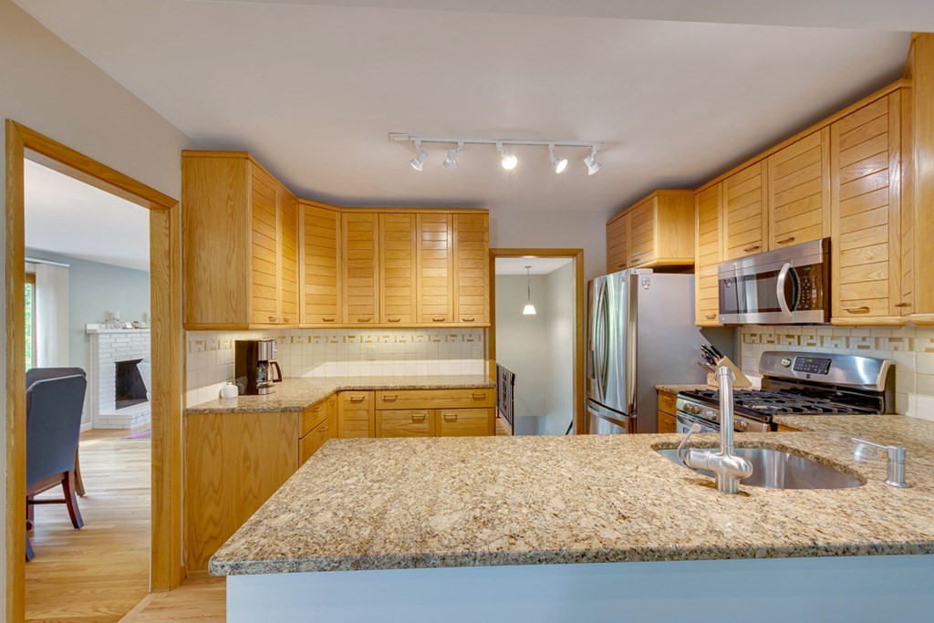 65 Angelica Drive Framingham, MA 01701 - Photo 14 of 34 a bathroom with a granite countertop sink and a large mirror