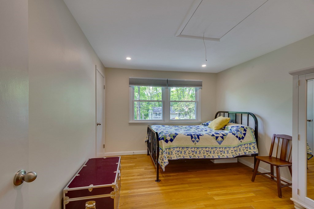 65 Angelica Drive Framingham, MA 01701 - Photo 19 of 34 a bedroom with furniture and a window