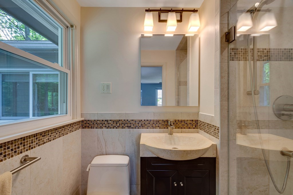 65 Angelica Drive Framingham, MA 01701 - Photo 23 of 34 a bathroom with a sink and a mirror