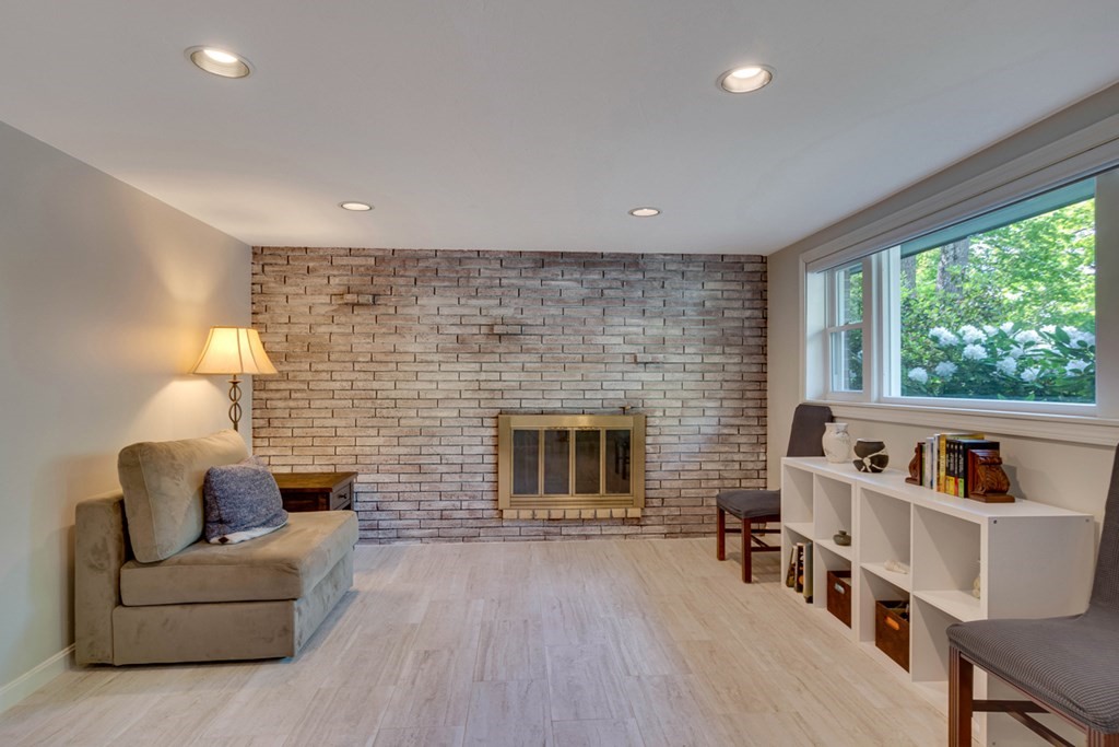 65 Angelica Drive Framingham, MA 01701 - Photo 25 of 34 a living room with furniture and a fireplace