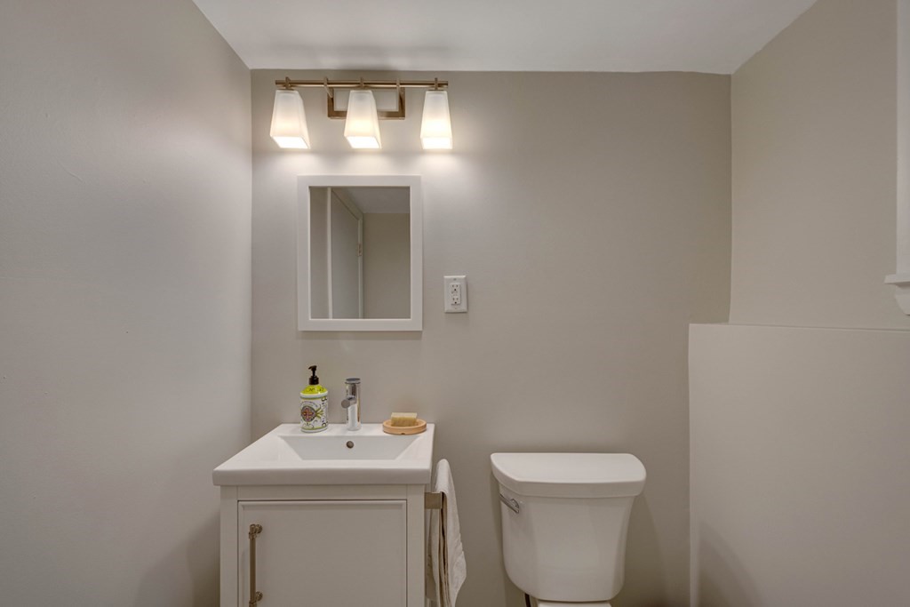 65 Angelica Drive Framingham, MA 01701 - Photo 28 of 34 a bathroom with a toilet sink and mirror