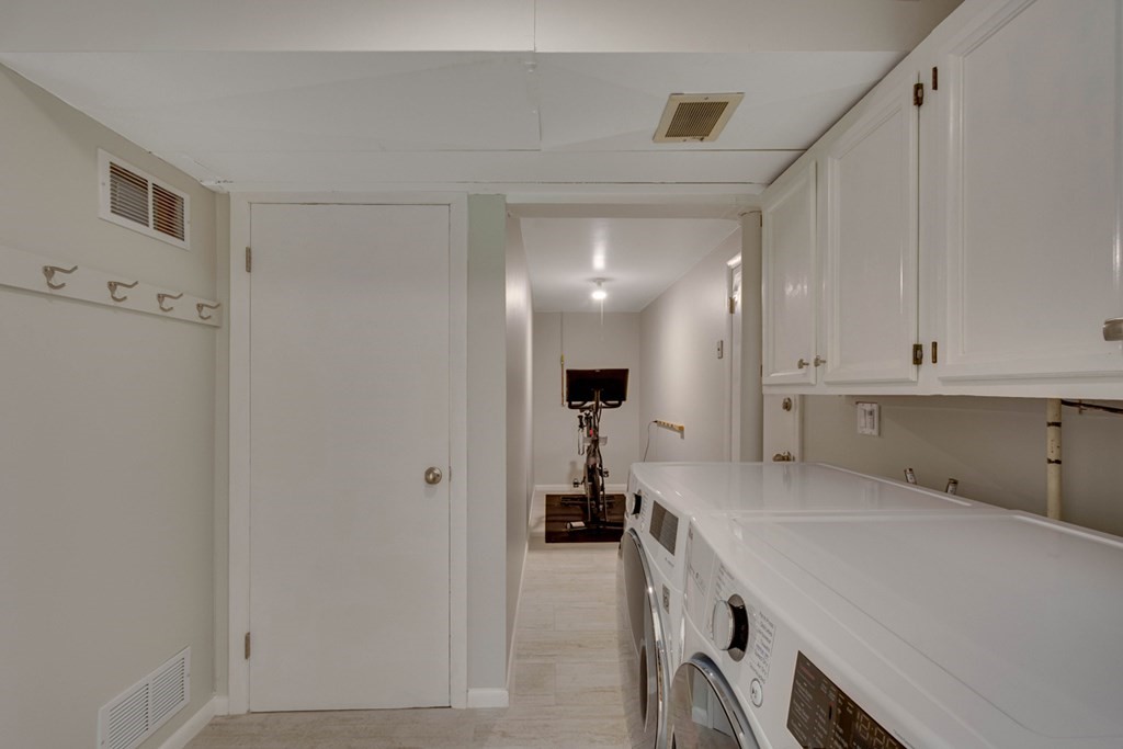 65 Angelica Drive Framingham, MA 01701 - Photo 29 of 34 a room with a white cabinets and entryway