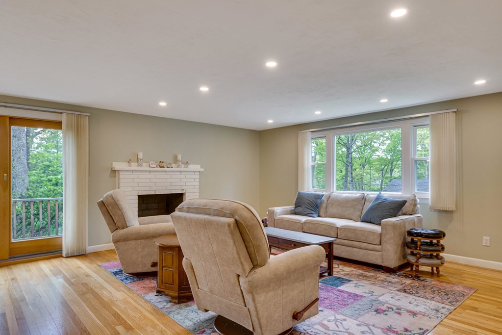 65 Angelica Drive Framingham, MA 01701 - Photo 3 of 34 a living room with furniture and a fireplace