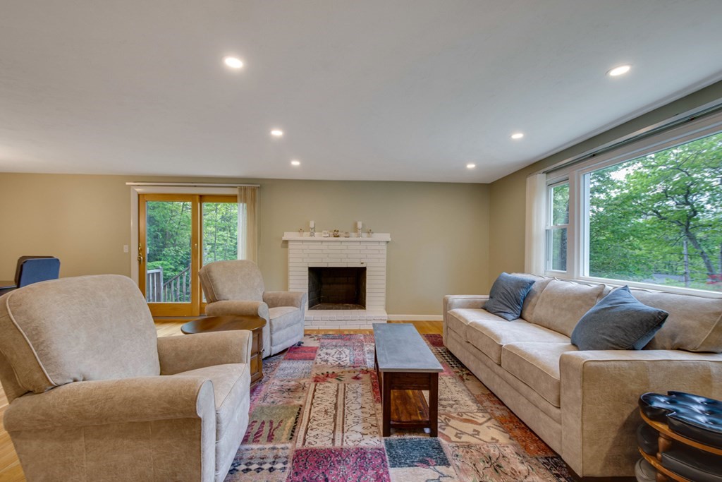 65 Angelica Drive Framingham, MA 01701 - Photo 4 of 34 a living room with furniture and a fireplace