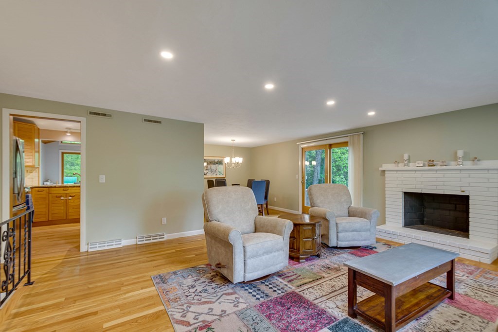65 Angelica Drive Framingham, MA 01701 - Photo 5 of 34 a living room with furniture and a fireplace