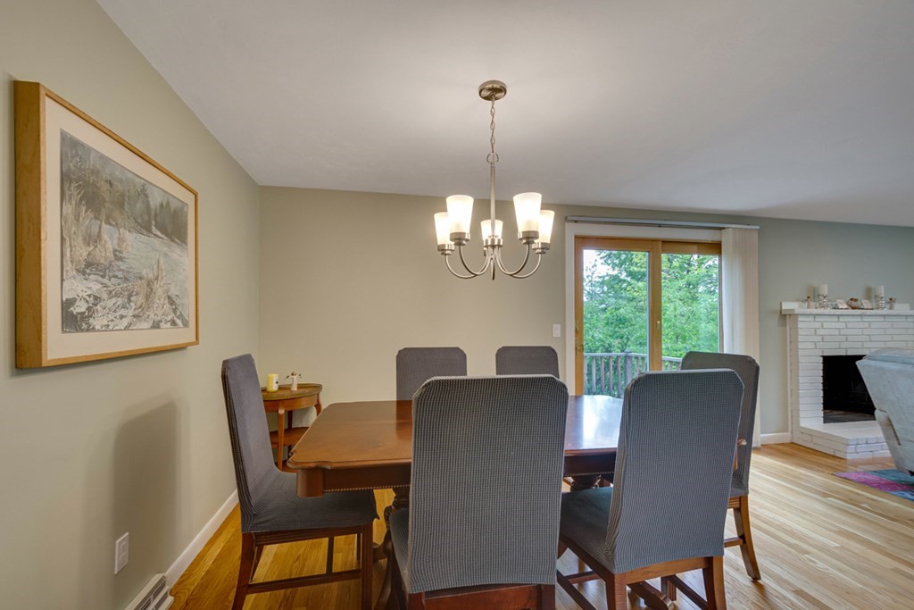 65 Angelica Drive Framingham, MA 01701 - Photo 8 of 34 a view of a dining room with furniture a chandelier and wooden floor