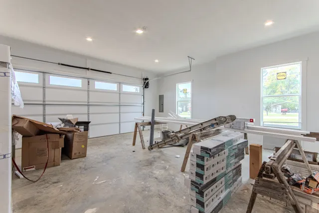 a view of a house with yard and sitting area