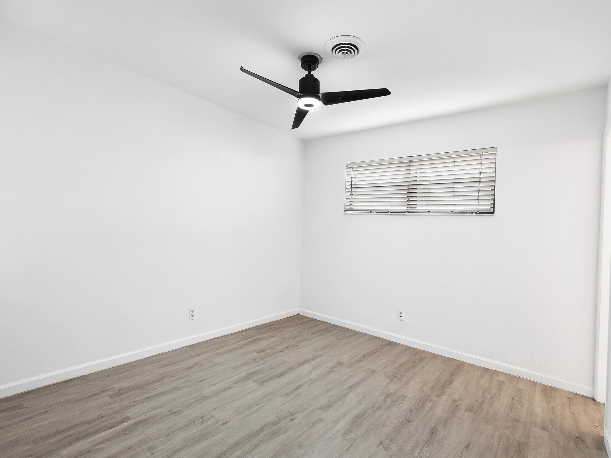 280 Northeast Wavecrest Way Boca Raton, FL 33432 - Photo 13 of 29 wooden floor in an empty room