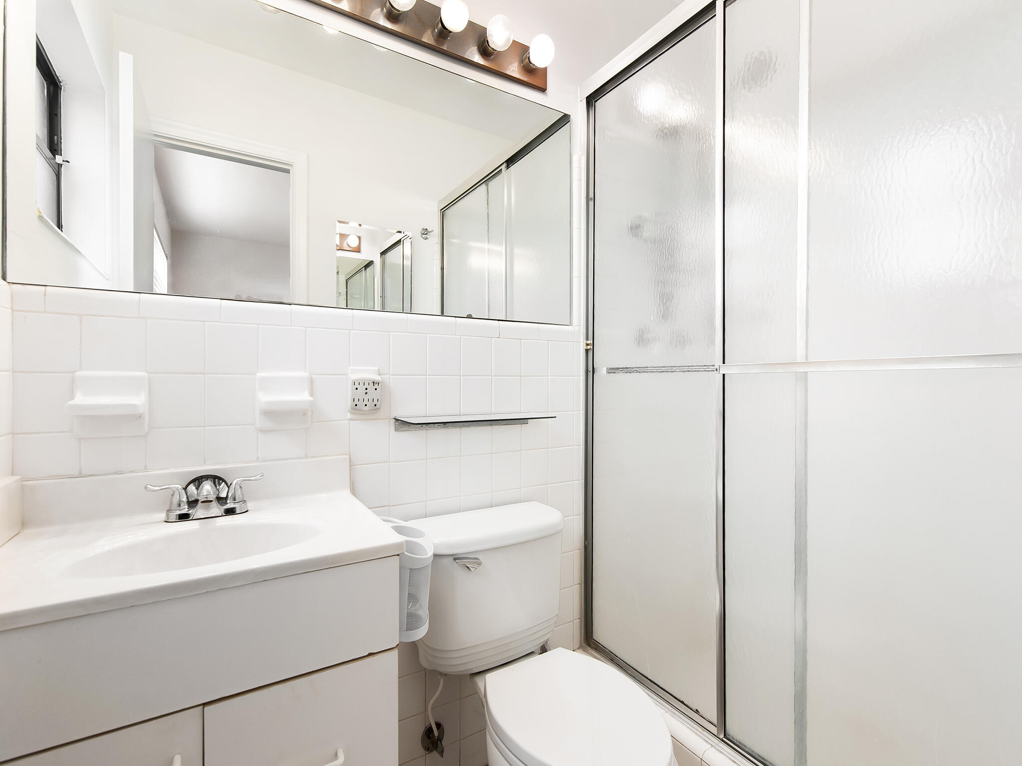 280 Northeast Wavecrest Way Boca Raton, FL 33432 - Photo 15 of 29 a bathroom with a sink a toilet and shower