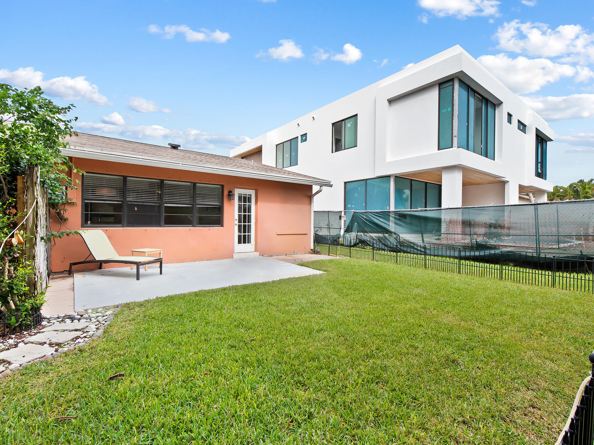 280 Northeast Wavecrest Way Boca Raton, FL 33432 - Photo 20 of 29 a view of a house with a yard patio and sitting area
