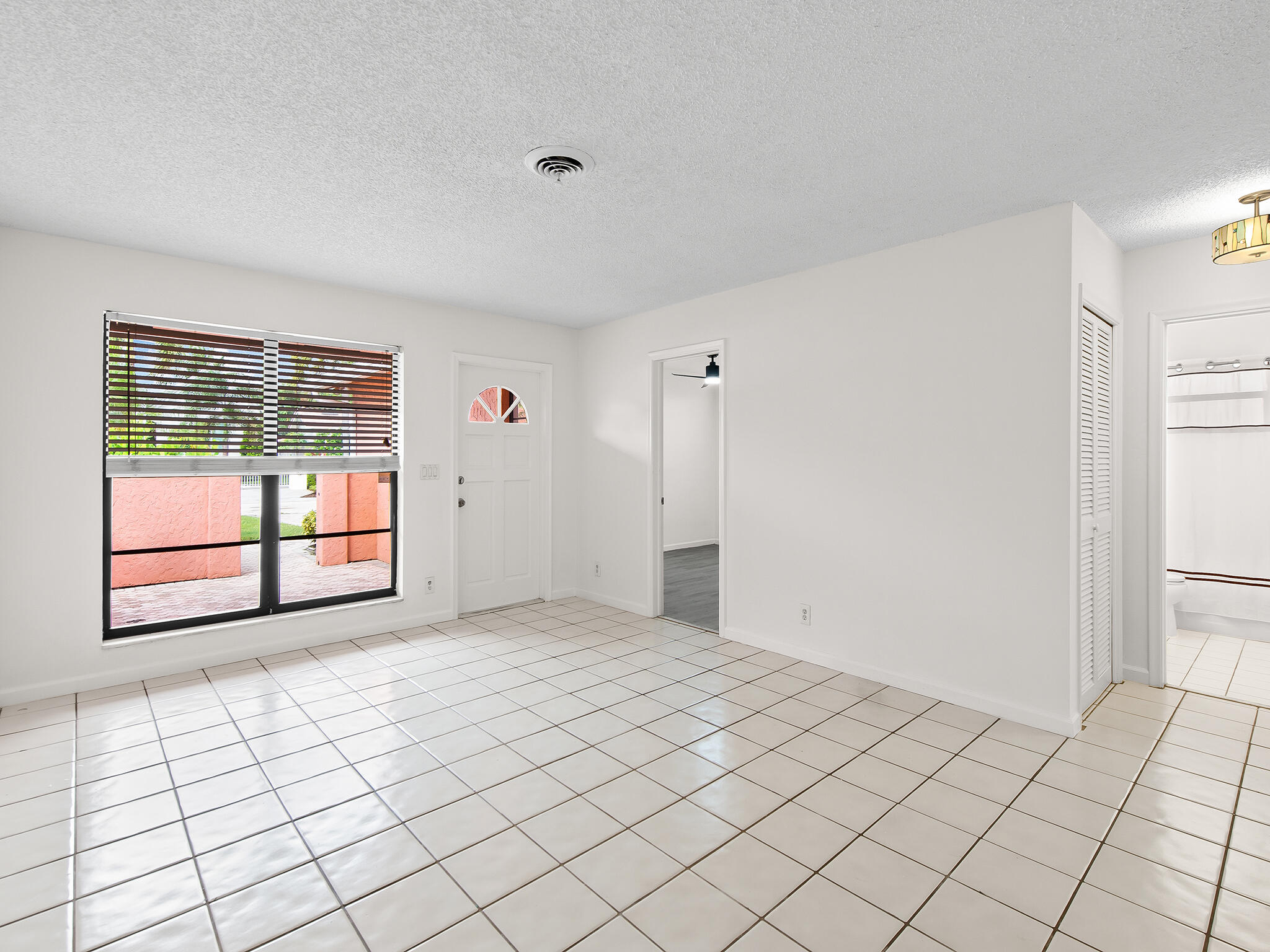 280 Northeast Wavecrest Way Boca Raton, FL 33432 - Photo 4 of 29 a view of empty room with window