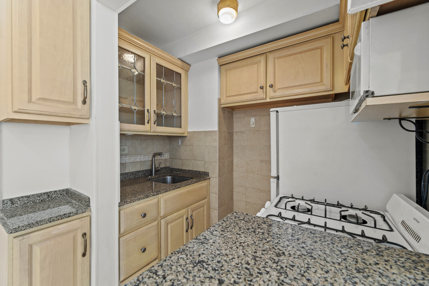 288 Lexington Avenue, Unit 3B Manhattan, NY 10016 - Photo 3 of 10 a kitchen with a sink and cabinets