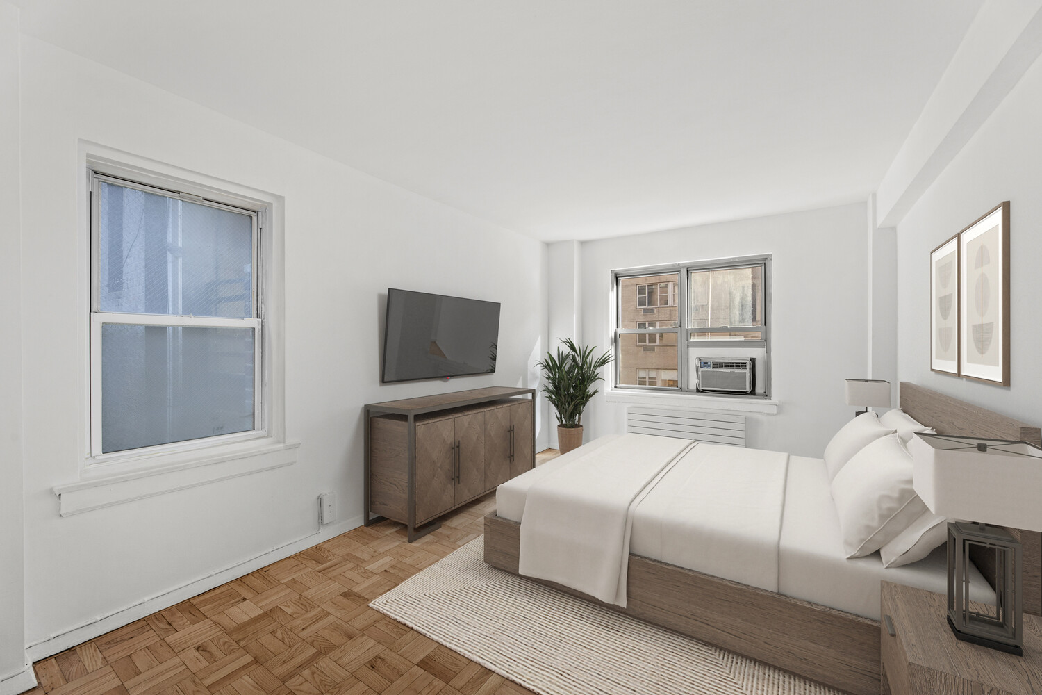 288 Lexington Avenue, Unit 3B Manhattan, NY 10016 - Photo 4 of 10 a bedroom with a large bed and a window
