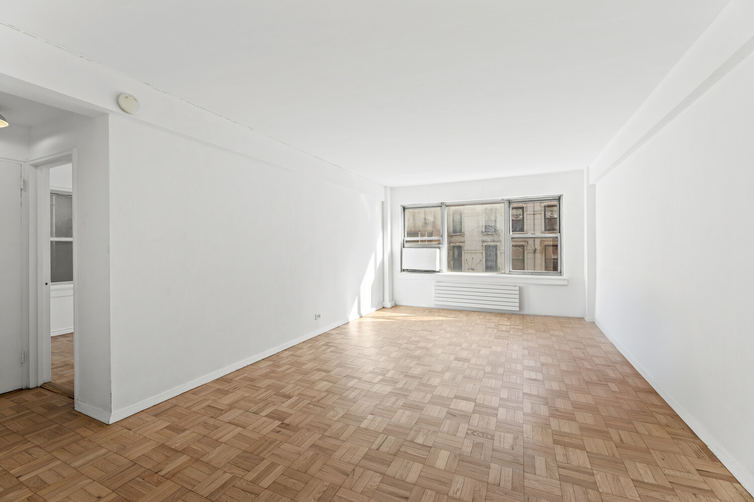 288 Lexington Avenue, Unit 3B Manhattan, NY 10016 - Photo 6 of 10 a view of an empty room with a window