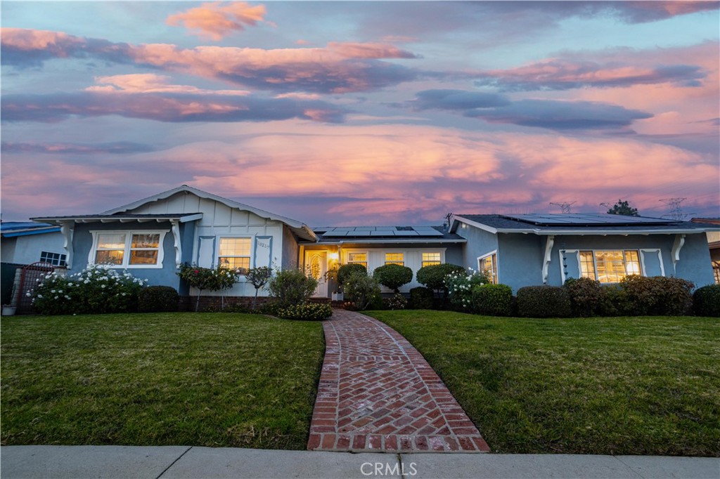 18217 Chatsworth Street Porter Ranch, CA 91326 - Photo 1 of 1 a front view of a house with a yard and garage