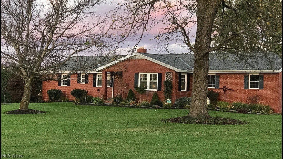 17031 Quarry Road Wellington, OH 44090 - Photo 2 of 31 house in spring/ summer