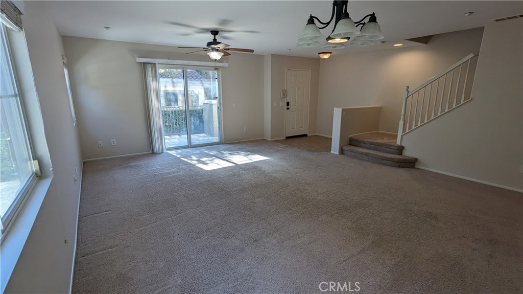 25862 Iris Avenue, Unit B Moreno Valley, CA 92551 - Photo 11 of 23 en empty room with windows and ceiling fan