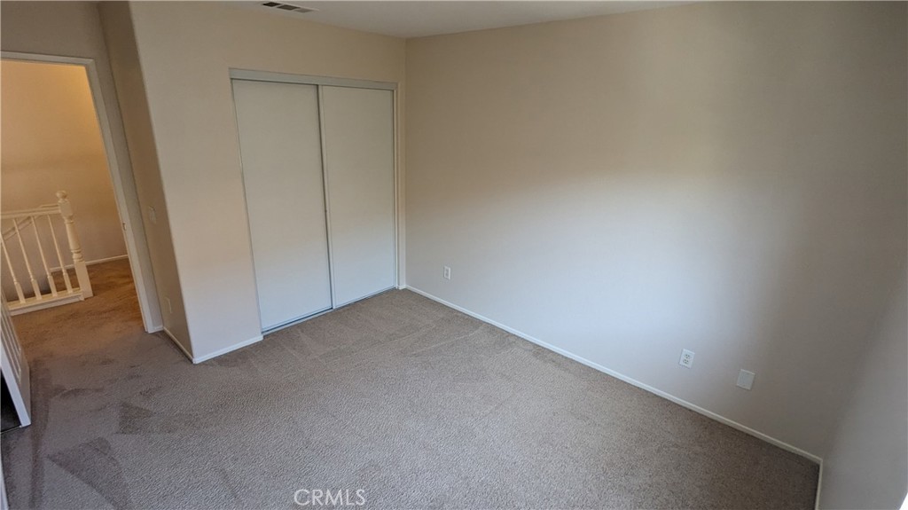 25862 Iris Avenue, Unit B Moreno Valley, CA 92551 - Photo 17 of 23 an empty room with a door