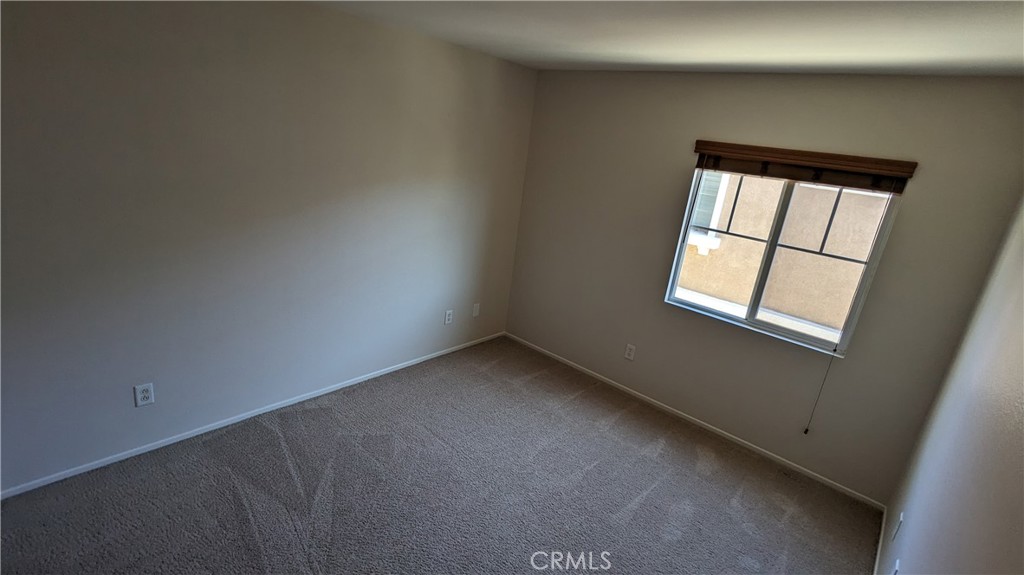 25862 Iris Avenue, Unit B Moreno Valley, CA 92551 - Photo 18 of 23 an empty room with a window