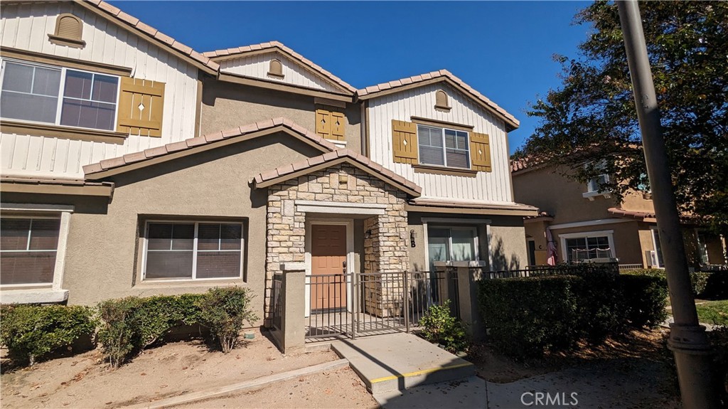 25862 Iris Avenue, Unit B Moreno Valley, CA 92551 - Photo 4 of 23 a front view of a house with garden