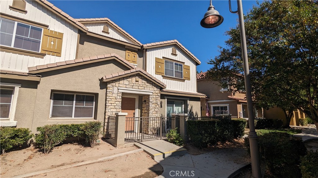 25862 Iris Avenue, Unit B Moreno Valley, CA 92551 - Photo 7 of 23 a front view of a house with garden