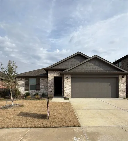 a front view of a house with garage