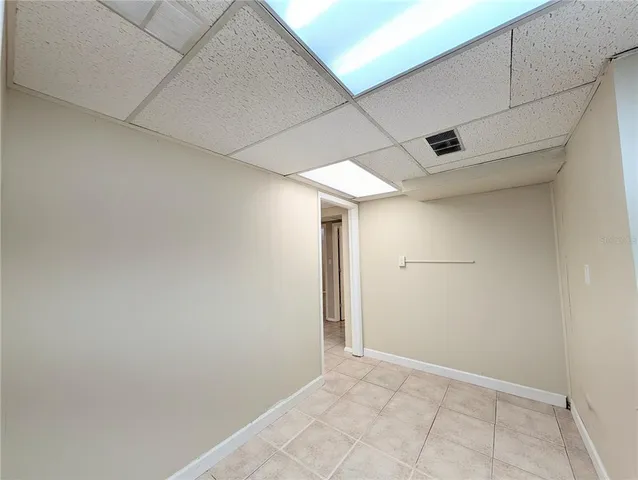 a view of an empty room with windows