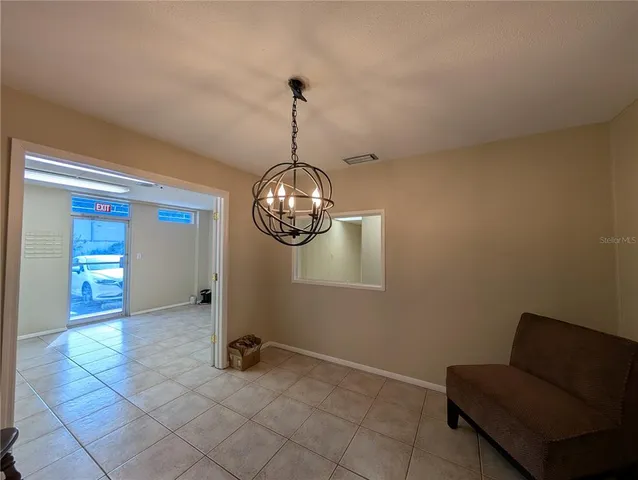 a bathroom with a sink and mirror with toilet