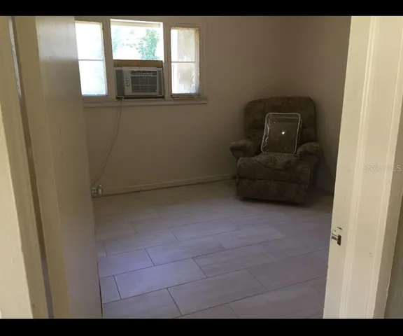 a view of an empty room with a window