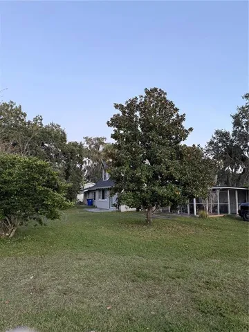 a view of a house with a big yard