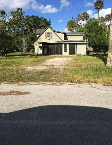 a view of a house with a ocean view