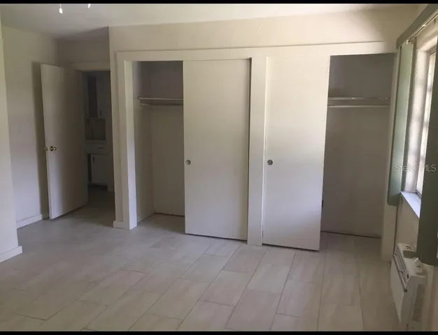 a view of empty room with closet