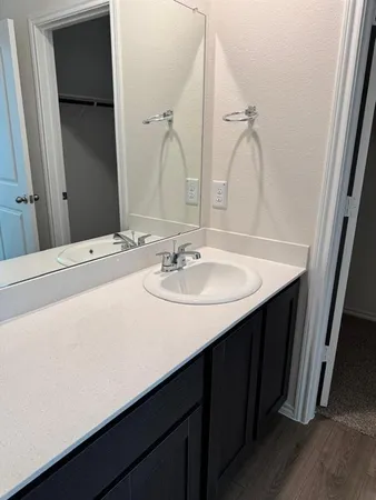a bathroom with a sink and a mirror