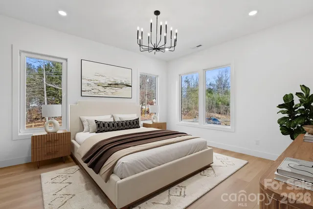 a bedroom with a large bed and a window