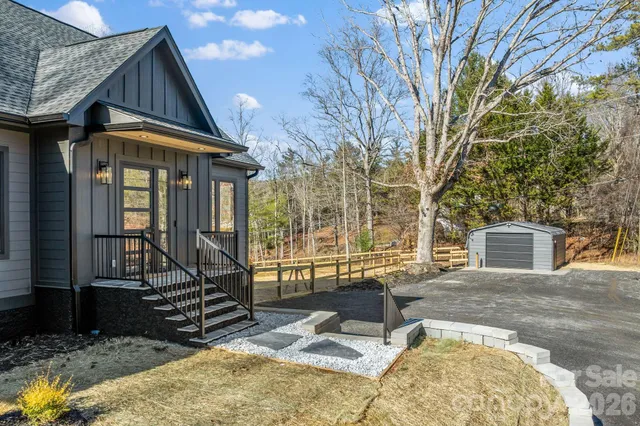 a house view with a outdoor seating