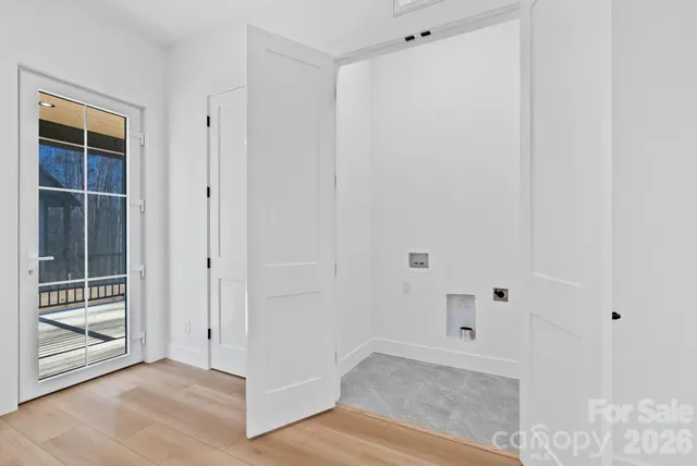 a view of an empty room with windows