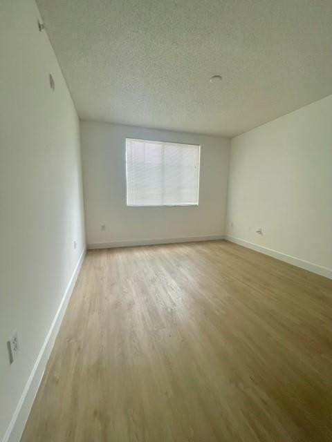 7930 North Nob Hill Road, Unit 106 Tamarac, FL 33321 - Photo 11 of 12 an empty room with windows