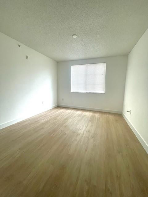 7930 North Nob Hill Road, Unit 106 Tamarac, FL 33321 - Photo 12 of 12 an empty room with a window