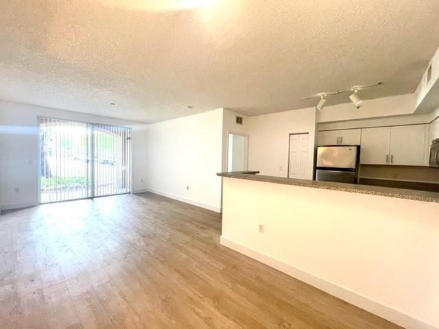 7930 North Nob Hill Road, Unit 106 Tamarac, FL 33321 - Photo 6 of 12 a view of an empty room and window